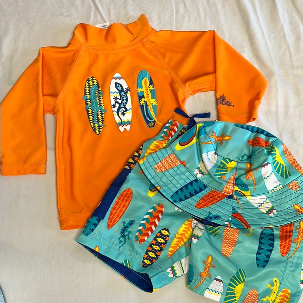 NWT 12-18M UV Skinz surfboard swim trunks, rash guard and hat set